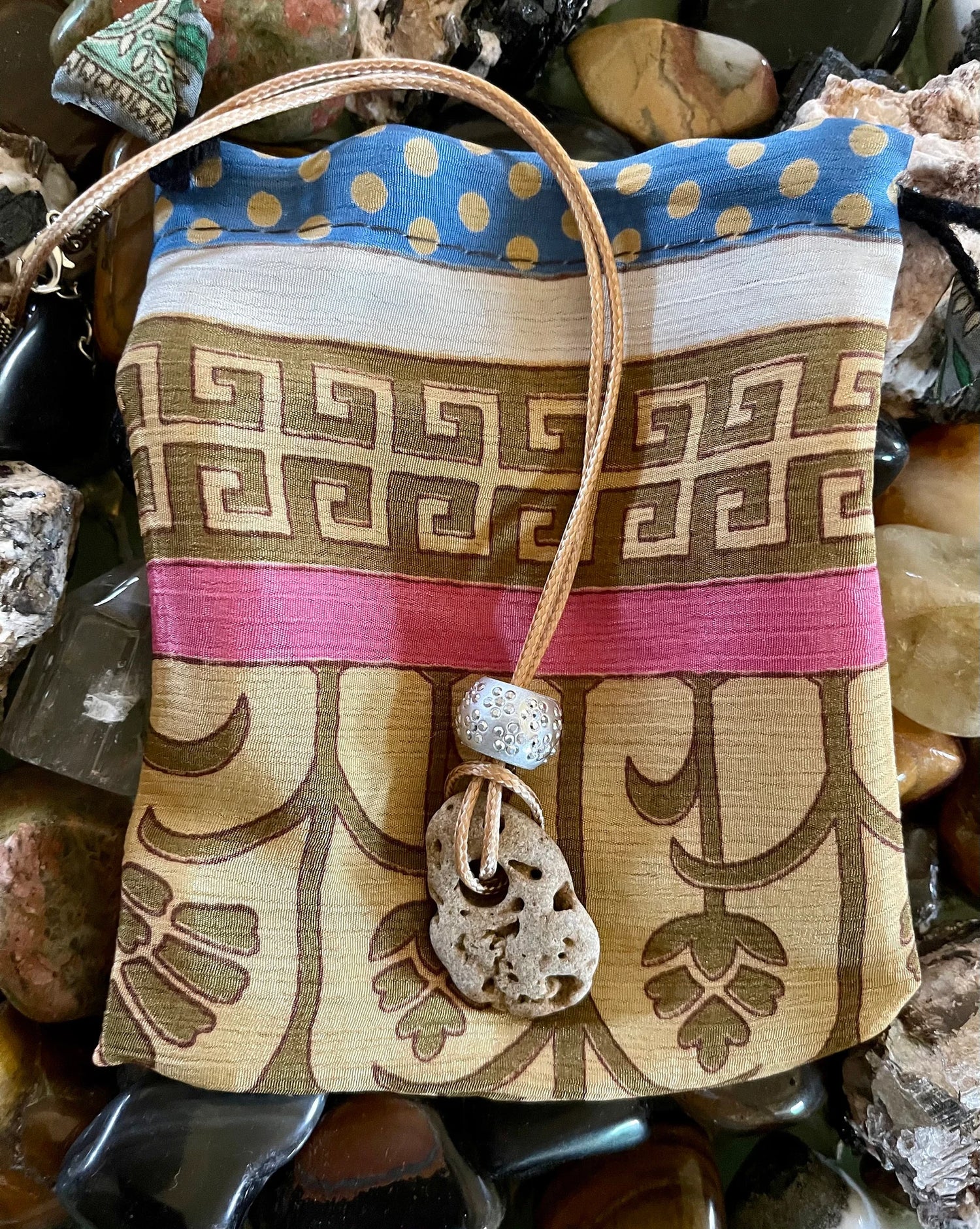 Spirited Bohemian Water Magic Amulet with Hand Crafted Silk Pouch, Bodhi Jewelry, Bodhi Leaf Market, hag stone, odin stone, hex stone, wishing stone, fairy stone, island stone, beach stone, stone necklace, stone gift